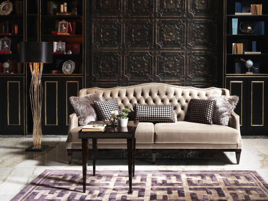 Elegant three-seater Chesterfield sofa in gray - timeless upholstered furniture for your home