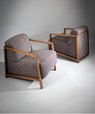 Stylishly compact mid-century armchair made of wood and upholstered fabric