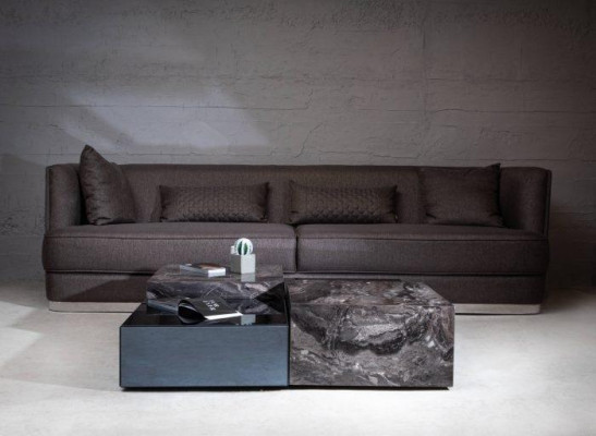 Stylish coffee table made of glass in a minimalist style for the living room