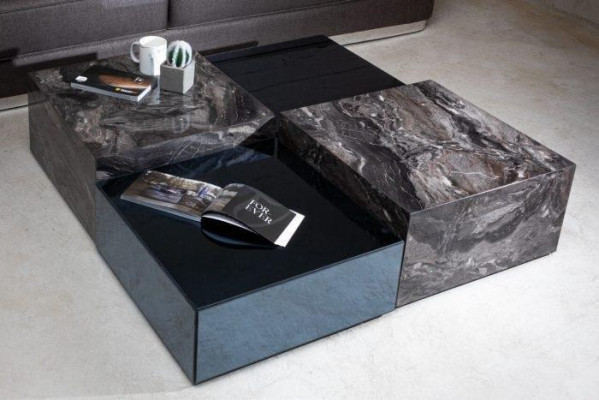 Stylish coffee table made of glass in a minimalist style for the living room