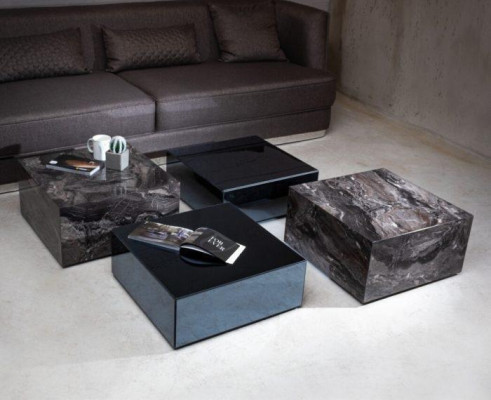 Stylish coffee table made of glass in a minimalist style for the living room