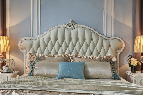 Elegant Chesterfield bed in classic style with matching bedside tables