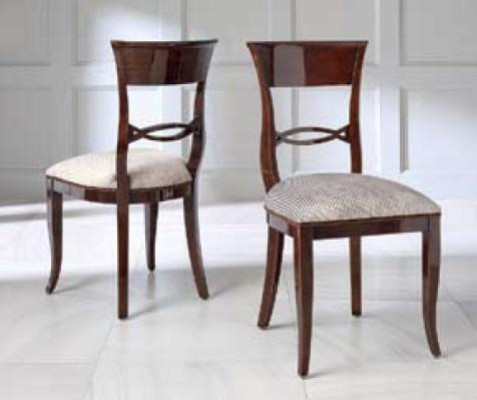 Elegant dining table with chairs in dark brown color with shiny surface