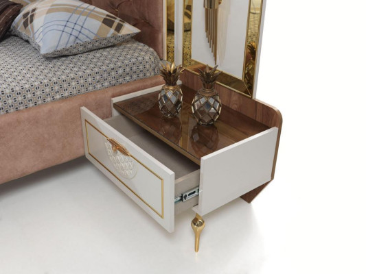 Elegant Chesterfield comfort bed with gold legs and matching bedside tables