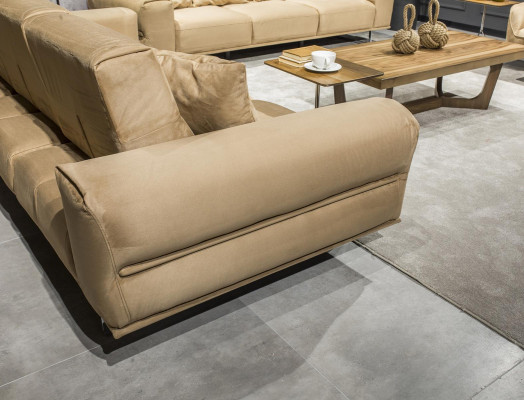 Luxurious Italian cream three-seater sofa with lush cushions