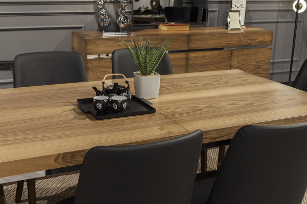 Elegant wooden table with chic black chairs in a modern design