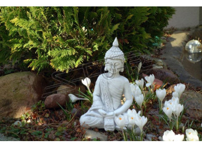 Decorative figure Buddha sculpture in stone effect. Large sculpture for garden
