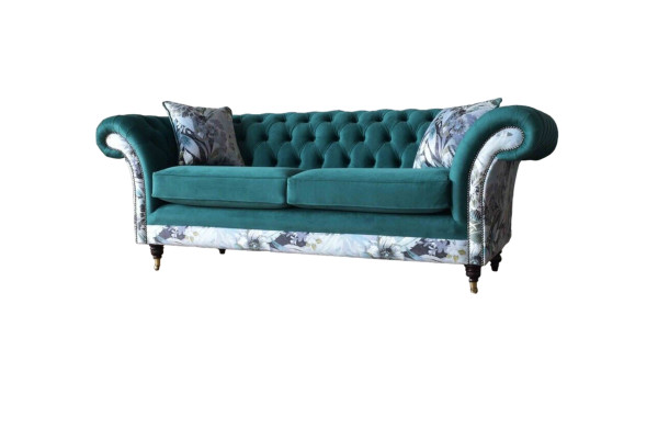 A vibrant three-seater Chesterfield sofa in a delicate emerald color with a floral pattern