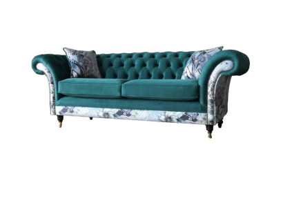 A vibrant three-seater Chesterfield sofa in a delicate emerald color with a floral pattern