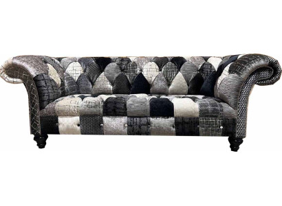 Luxurious velvet sofa in Chesterfield design with colorful checks