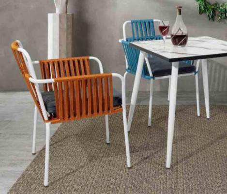 Original light color chair on white stainless steel legs and a soft seat cushion