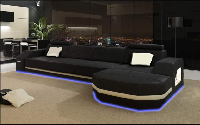 Elegant black corner sofa in L-shape. Stylish furniture for your home