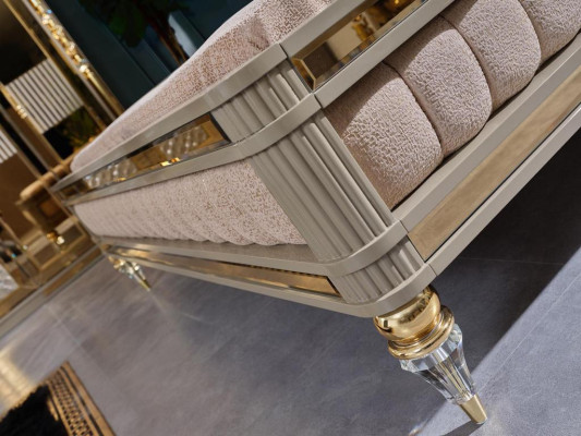 Double bed with two bedside tables in a high-quality luxury design in beige with golden elements