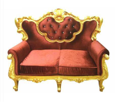 Chic 2-seater sofa with a bright color combination of elegant red and shiny gold tone in baroque style