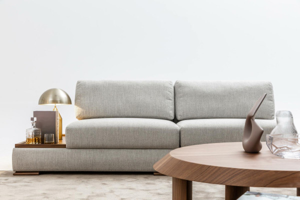 Slim, modern 2-seater soft sofa with integrated wooden table and wide seat