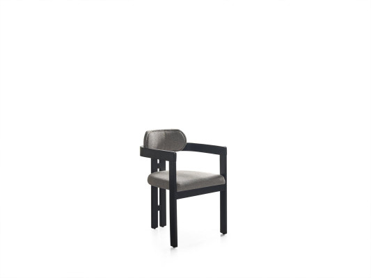 An ultra-modern chair with an unusual shape and interesting legs with a comfortable backrest in gray-black for the dining room
