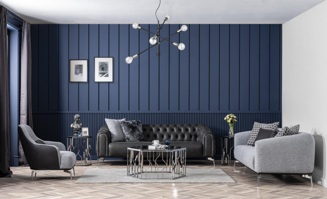 Black Chesterfield style four-seater straight sofa for the living room