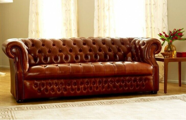 Brown Chesterfield three-seater designer 3-seater sofa. Stylish couch