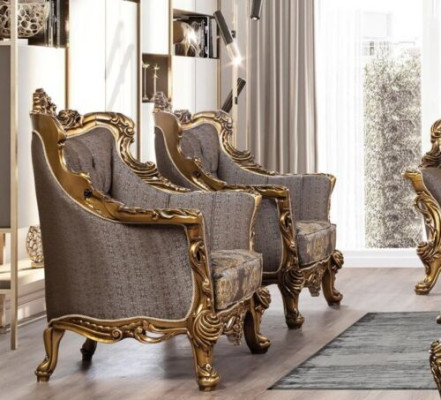 A luxurious Classic r wing chair in dark gray with a golden baroque design from Chesterfield