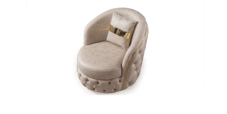 A luxurious, modern armchair in a light beige tone from Chesterfield