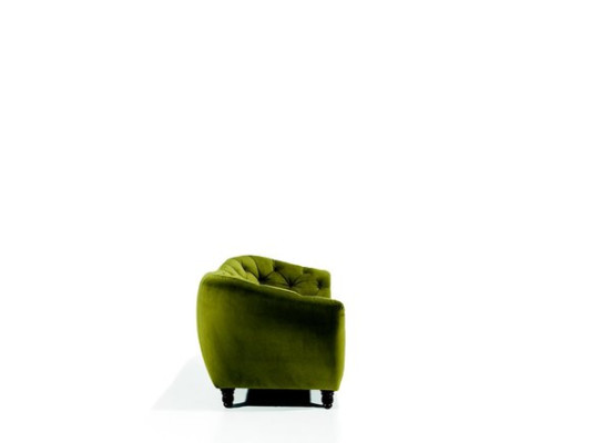 Three-seater sofa with luxurious Chesterfield backrest in an elegant shade of green